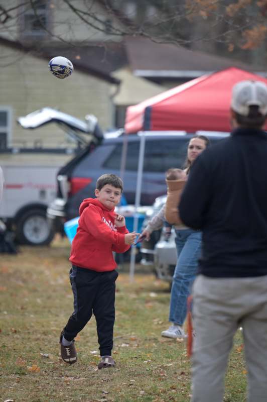 a boy throwing a football ball
