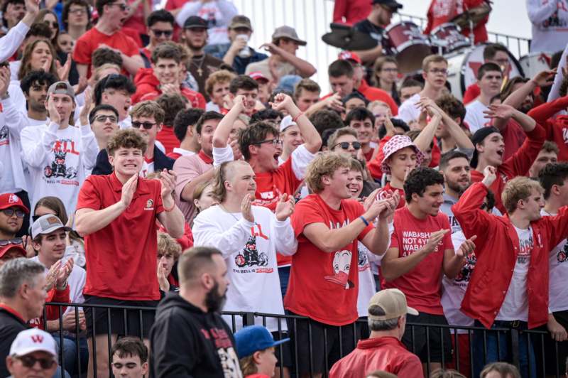 a group of people in red shirts
