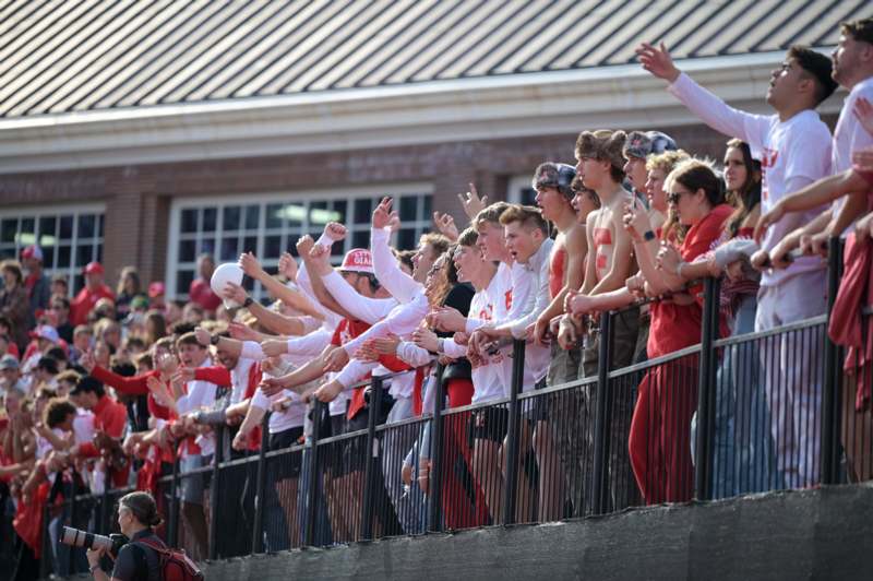 a group of people standing on a railing
