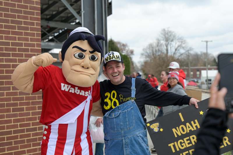 a man in a garment with a person in a uniform