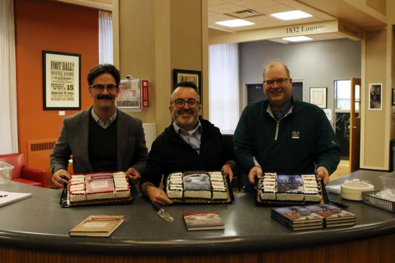 Religion Department's Book Party - a group of men holding cakes