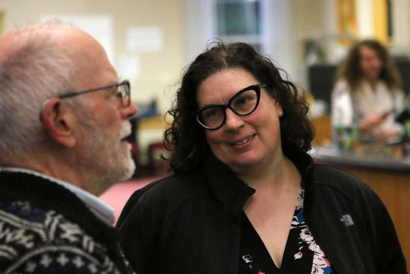 a man and woman looking at each other