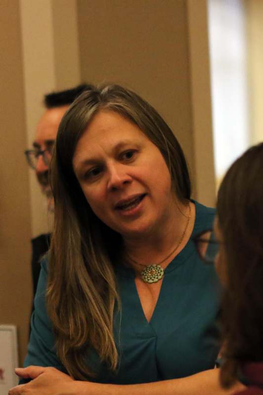 a woman in a teal shirt