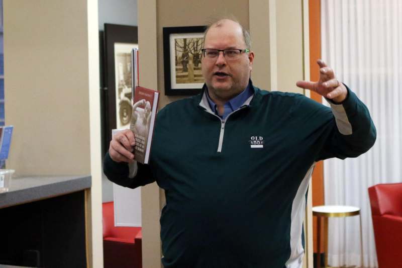 a man holding a book