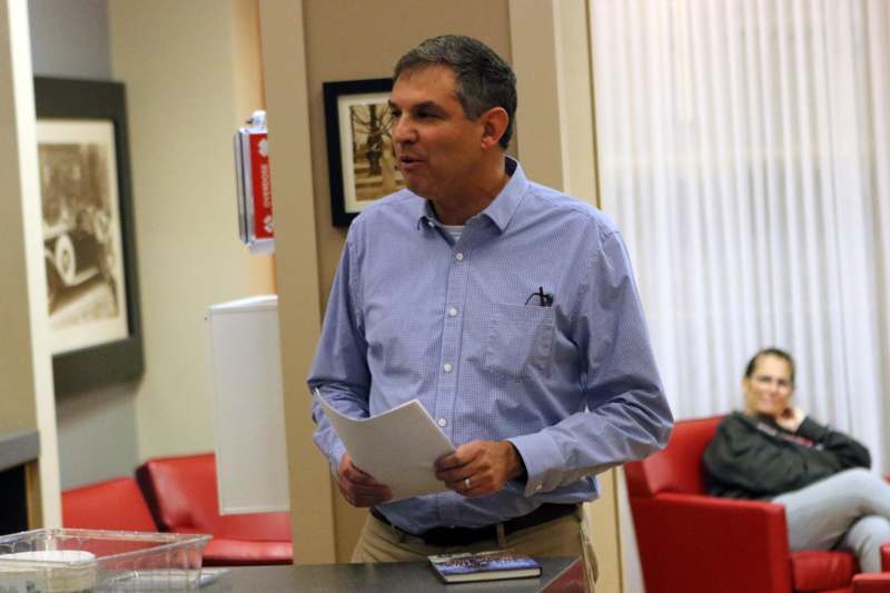 a man holding a paper