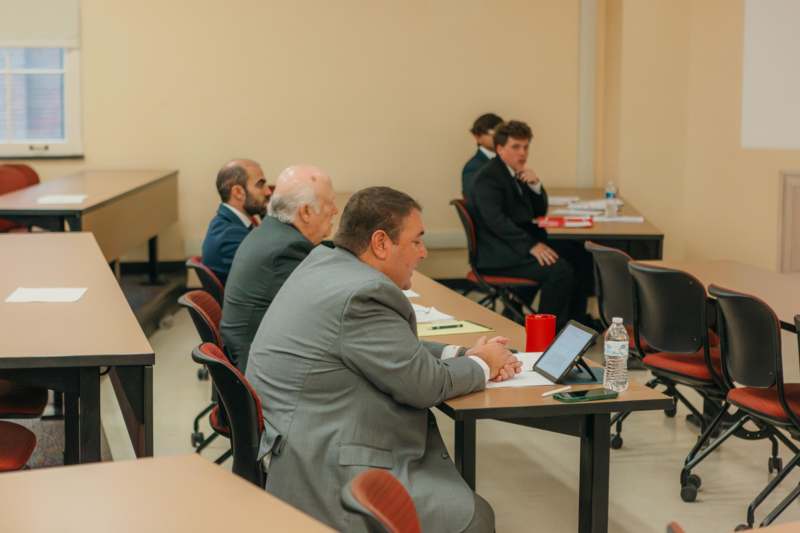 a group of men sitting at tables