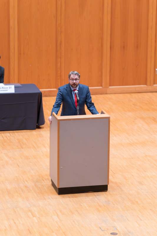 a man standing at a podium