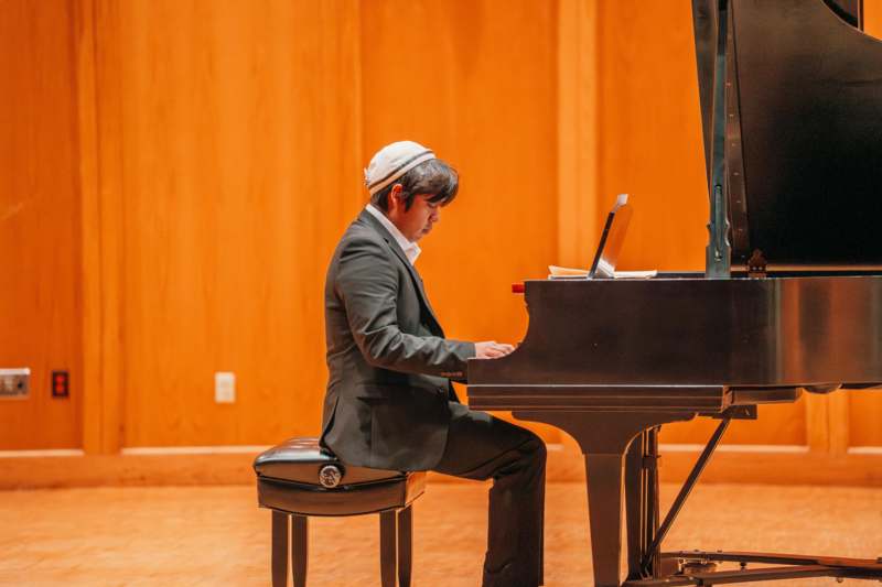 a man playing a piano