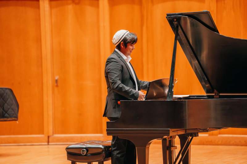 a man playing a piano