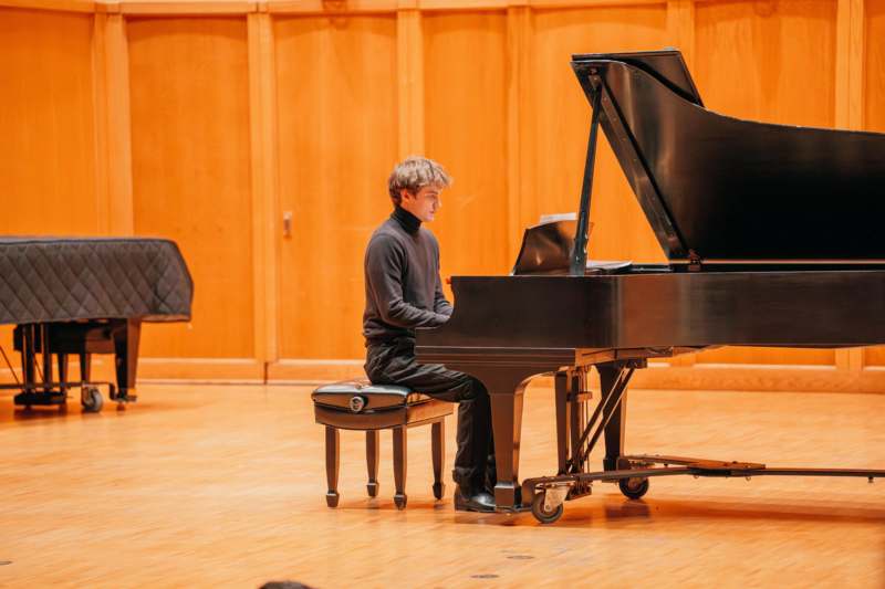 a man playing a piano