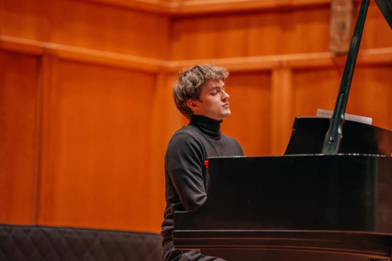 a man playing a piano