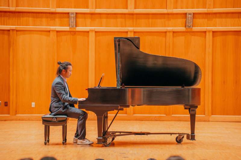 a man playing a piano