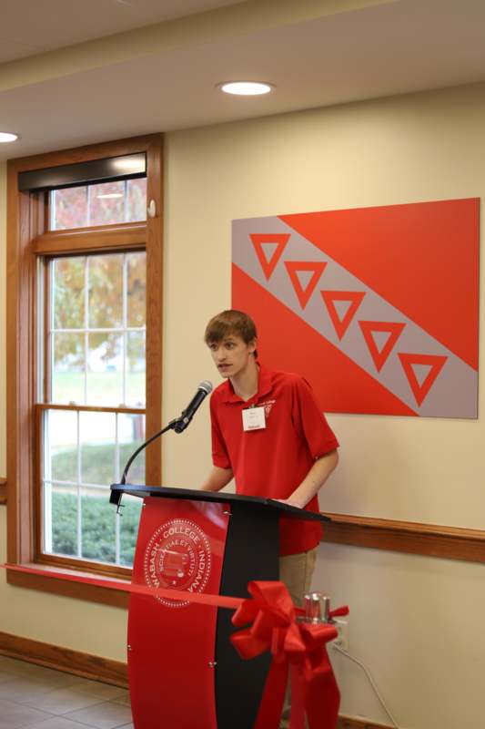 a man standing at a podium