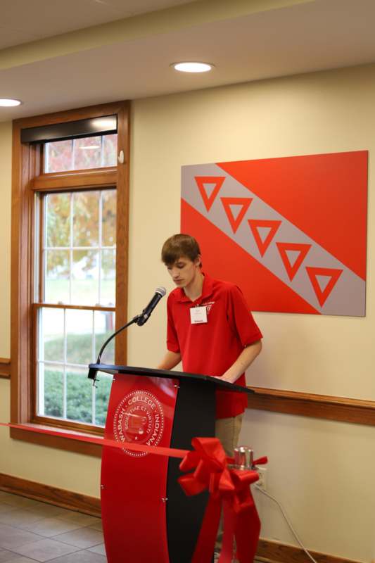 a man standing at a podium
