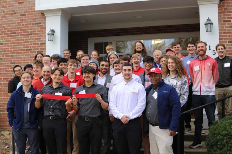 a group of people standing outside a building