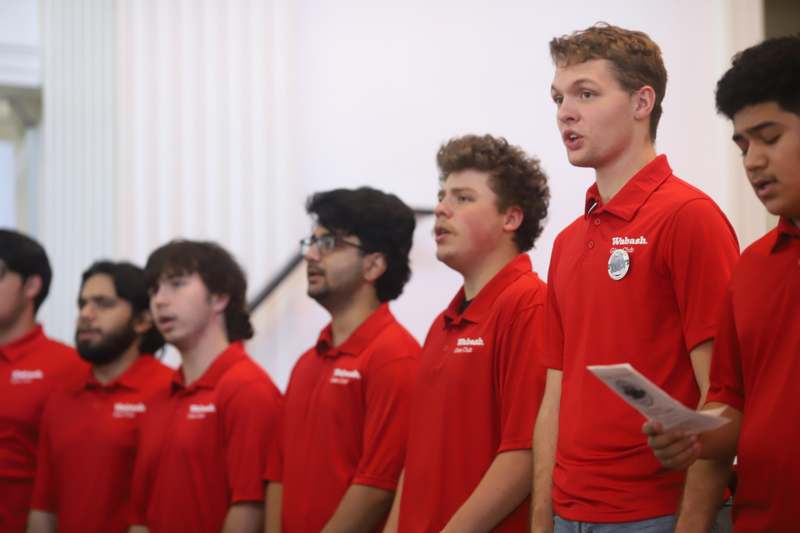 a group of people in red shirts
