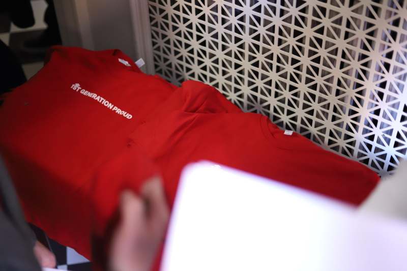 a person holding a red shirt