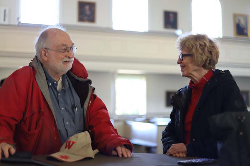 a man and woman sitting at a table