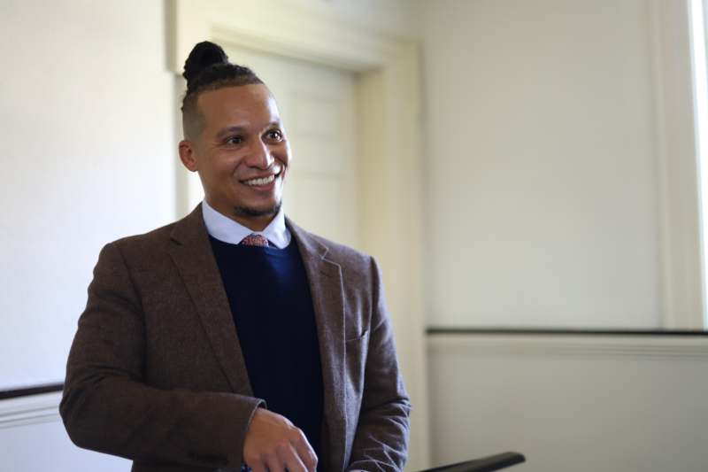 a man in a suit smiling