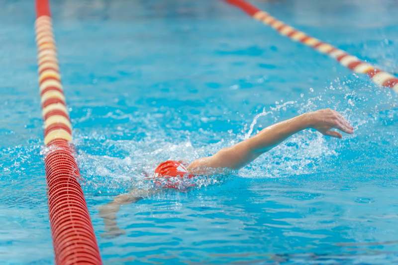 Indiana DIII Invitational Swim Meet - a person swimming in a pool