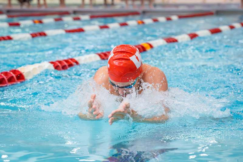 a person swimming in a pool
