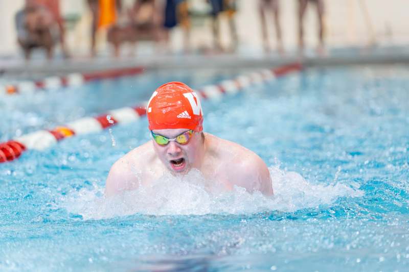 a man swimming in a pool