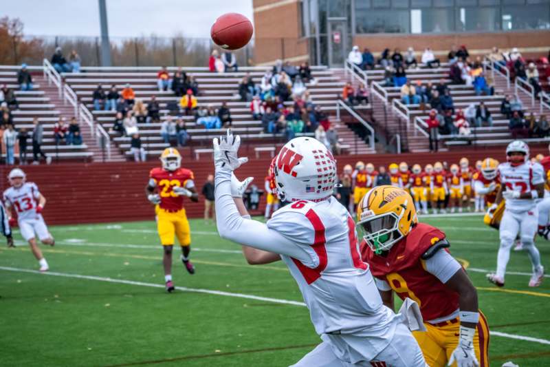 a football player catching a football