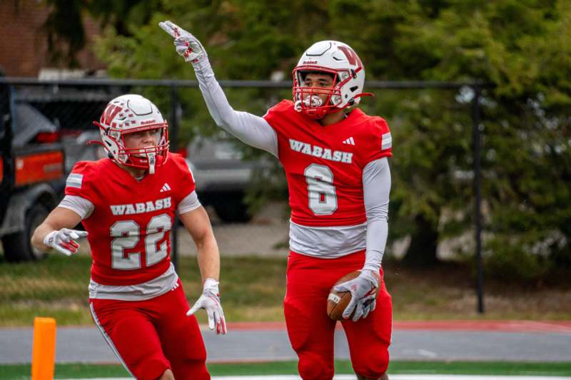 a football player holding a football