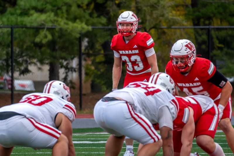 a football player in a red uniform