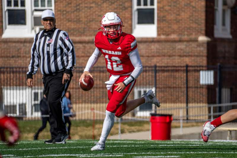 a football player running with a football