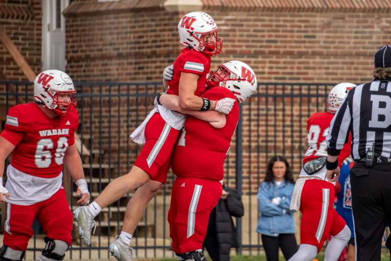 a group of football players hugging