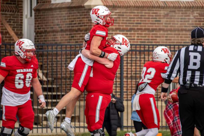 a group of football players hugging