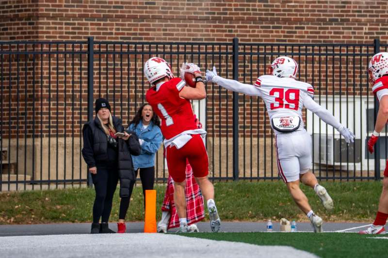 a football players running with a ball