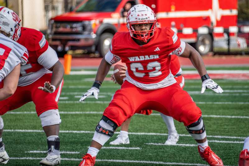 a football player in a red uniform