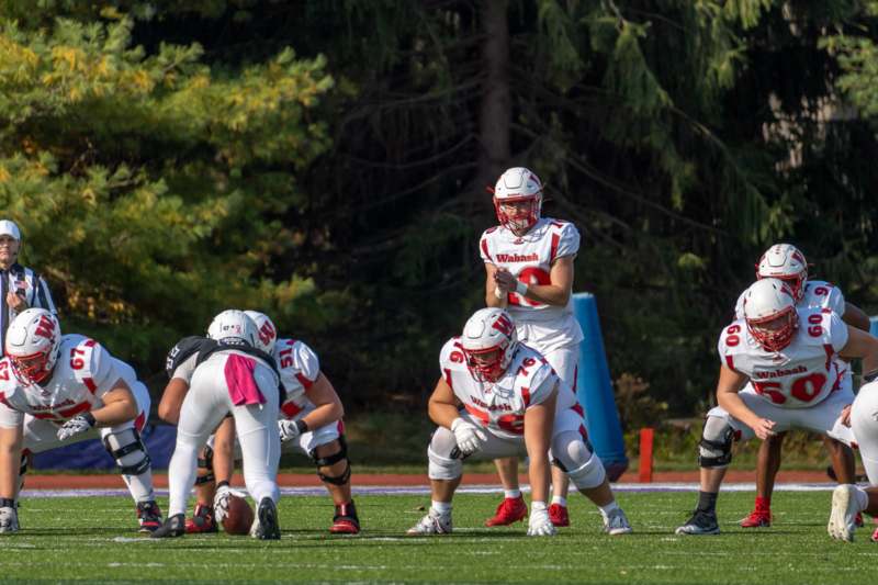 a group of people in football uniforms