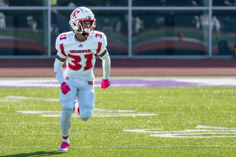 a football player running on a field