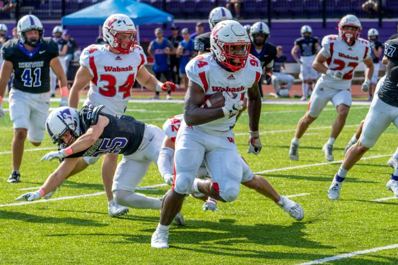 a football player running with the ball
