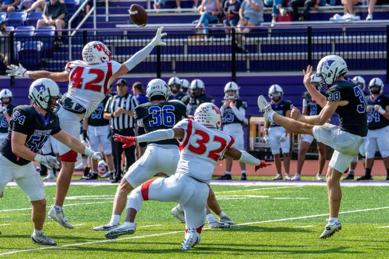 a group of people playing football