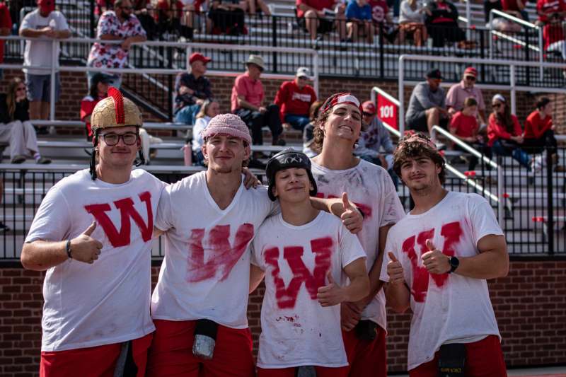 a group of men wearing red shirts
