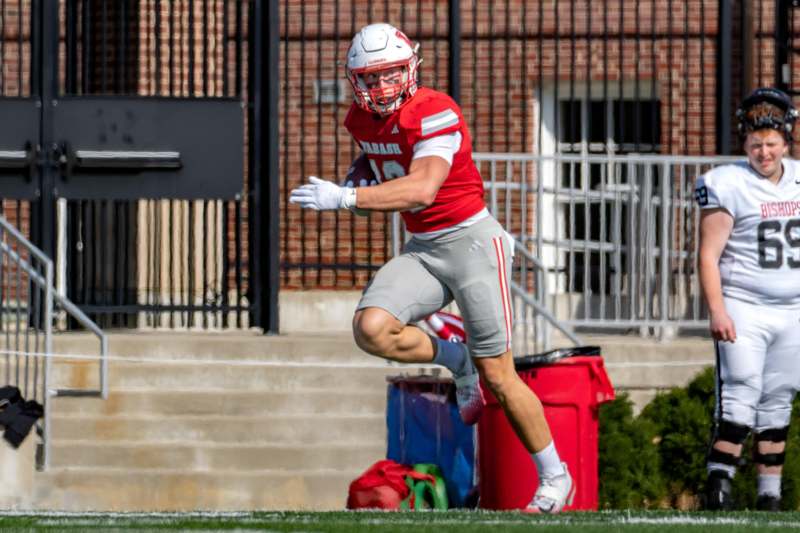 a football player running with a ball
