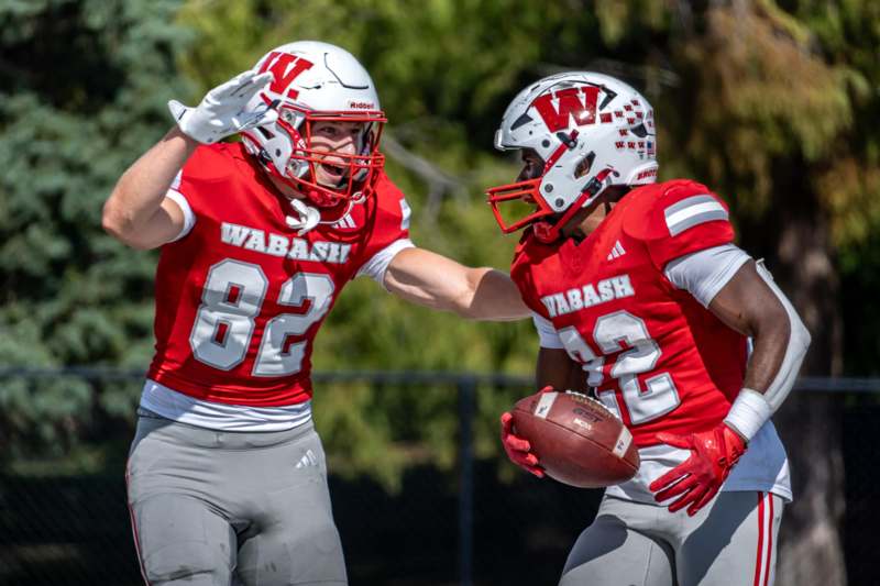 two football players in red and white uniforms