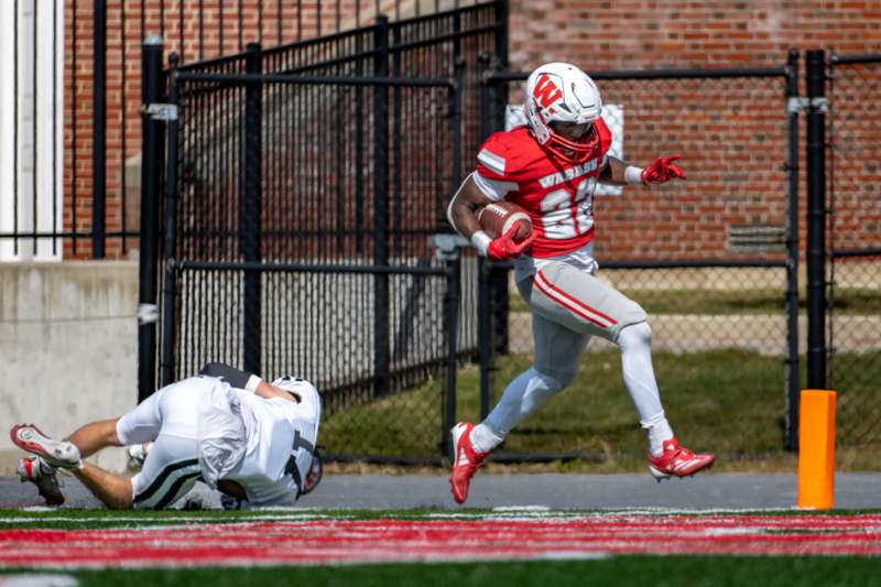 a football player running with a ball