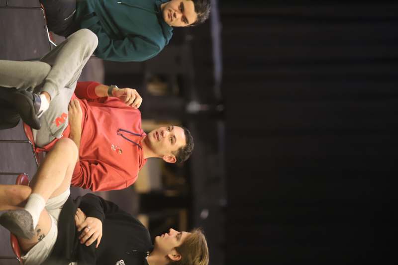 a group of men sitting on a stage