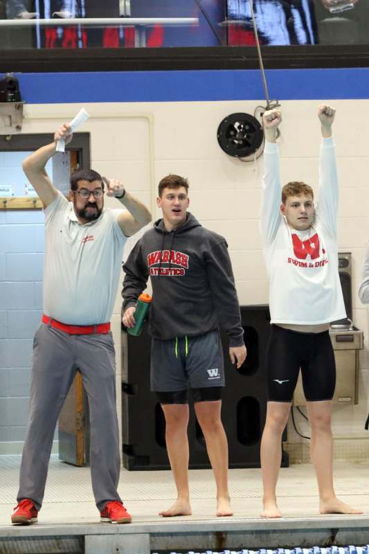 a group of men standing in a room