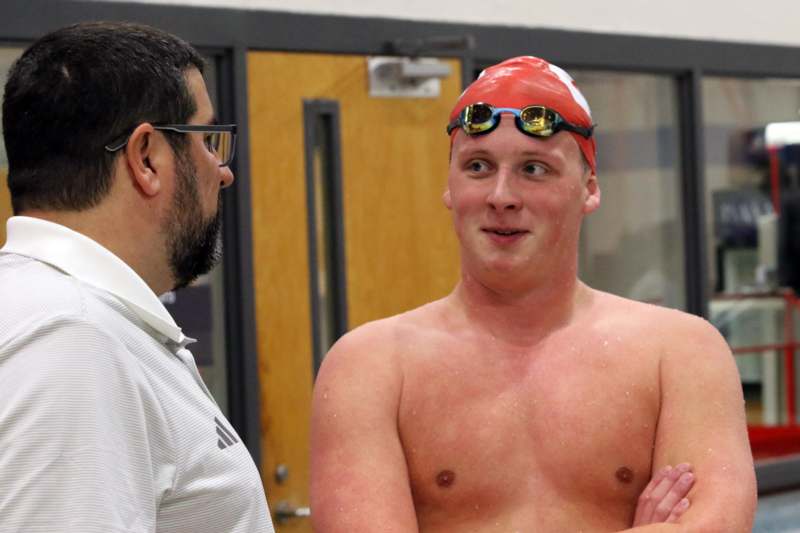 a man in a swim cap and goggles