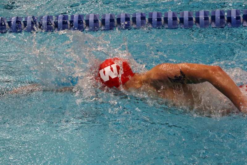 a person swimming in a pool