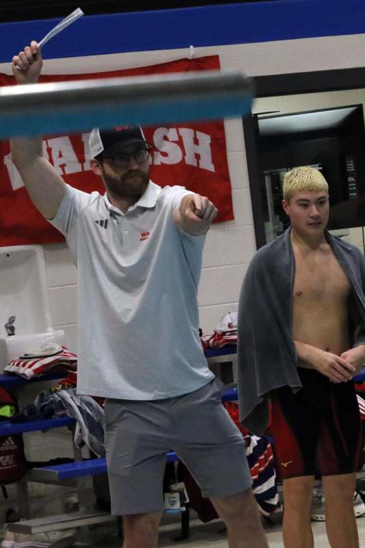 a man pointing at another man