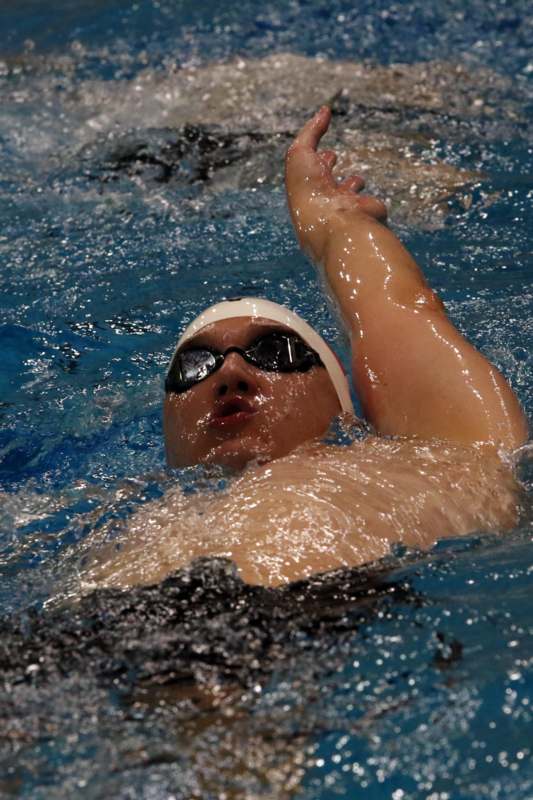 a man swimming in a pool