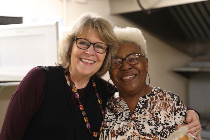 two women smiling at the camera