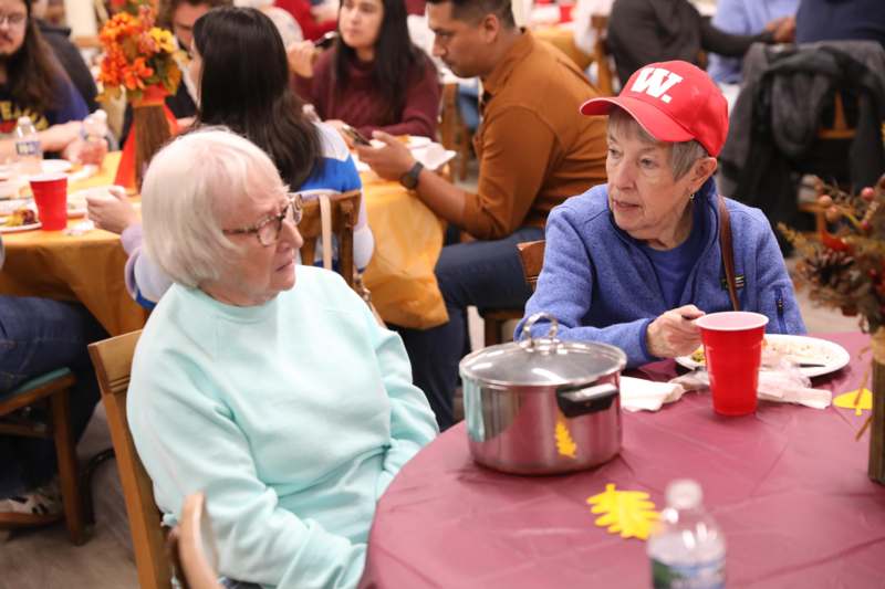 a group of people sitting at a table